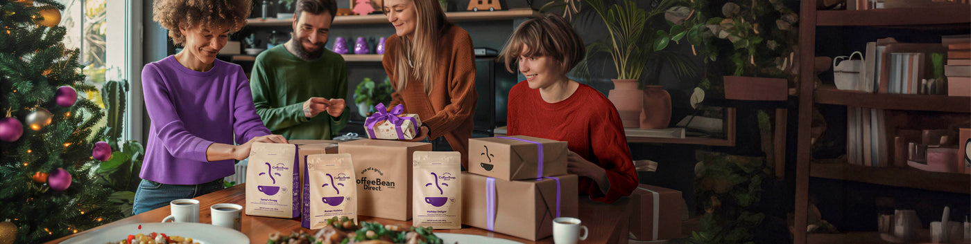 Holiday Bundles featured hero -- family surrounded by various Coffee Bean Direct 1lb coffee bags and gift boxes and a Christmas Tree