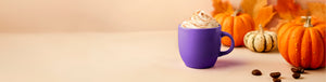 Pumpkin Spice Latte featured hero -- pumpkin spice latte in purple mug surrounded by pumpkins and coffee beans